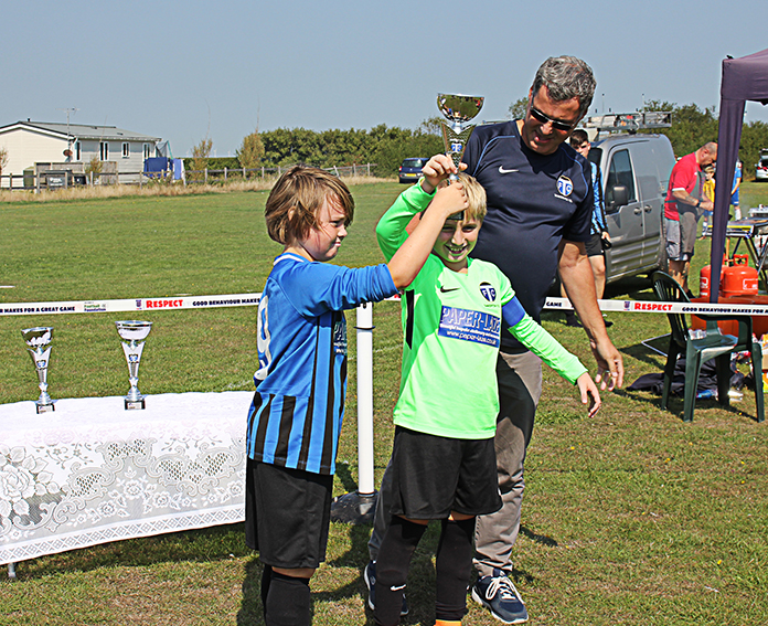 TFC Chairman, Andy Davidson, presents the Under 11s' trophy to Tankerton Colts
